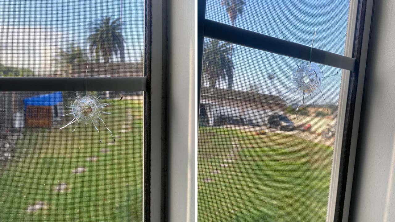 imagem da janela perfurada pela bala 