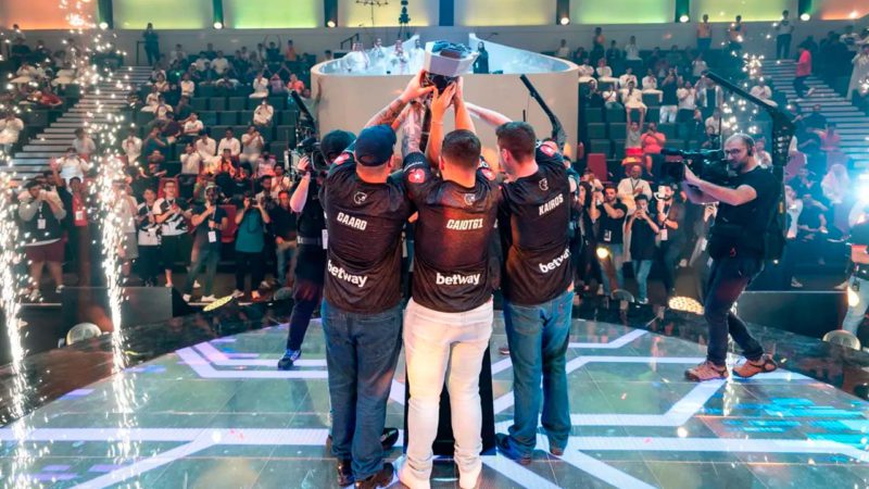 Image of FURIA lifting the Rocket LEague Gamers8 trophy