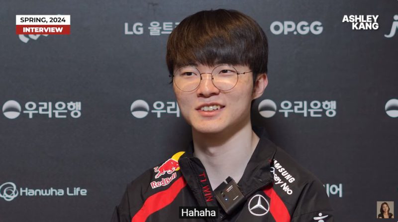 In the photo, Faker smiling in an interview with Ashley Kang